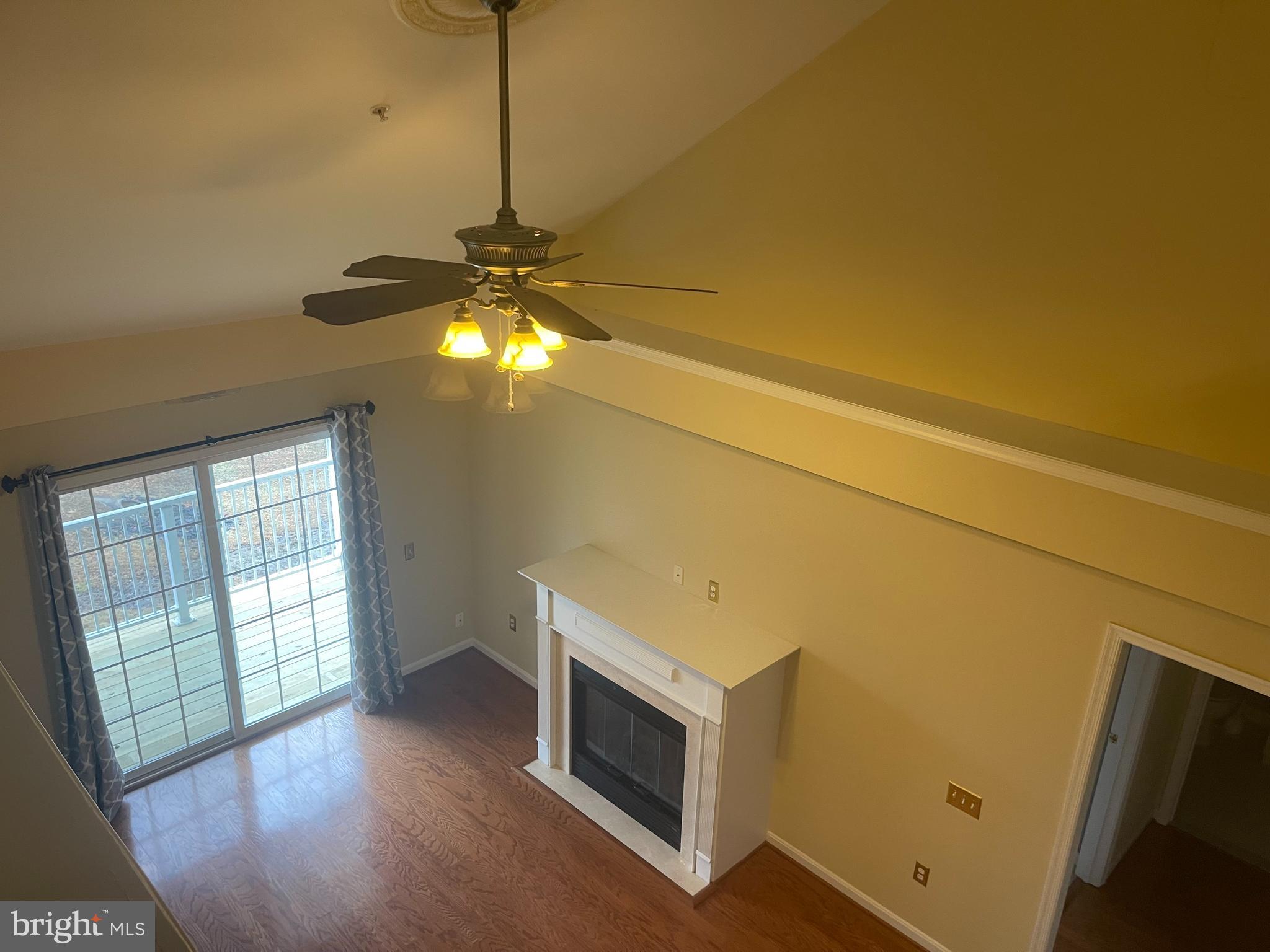 402 Aggies Circle, Unit L Bel Air, MD 21014 - Photo 7 of 23 a room with chandelier fan and windows