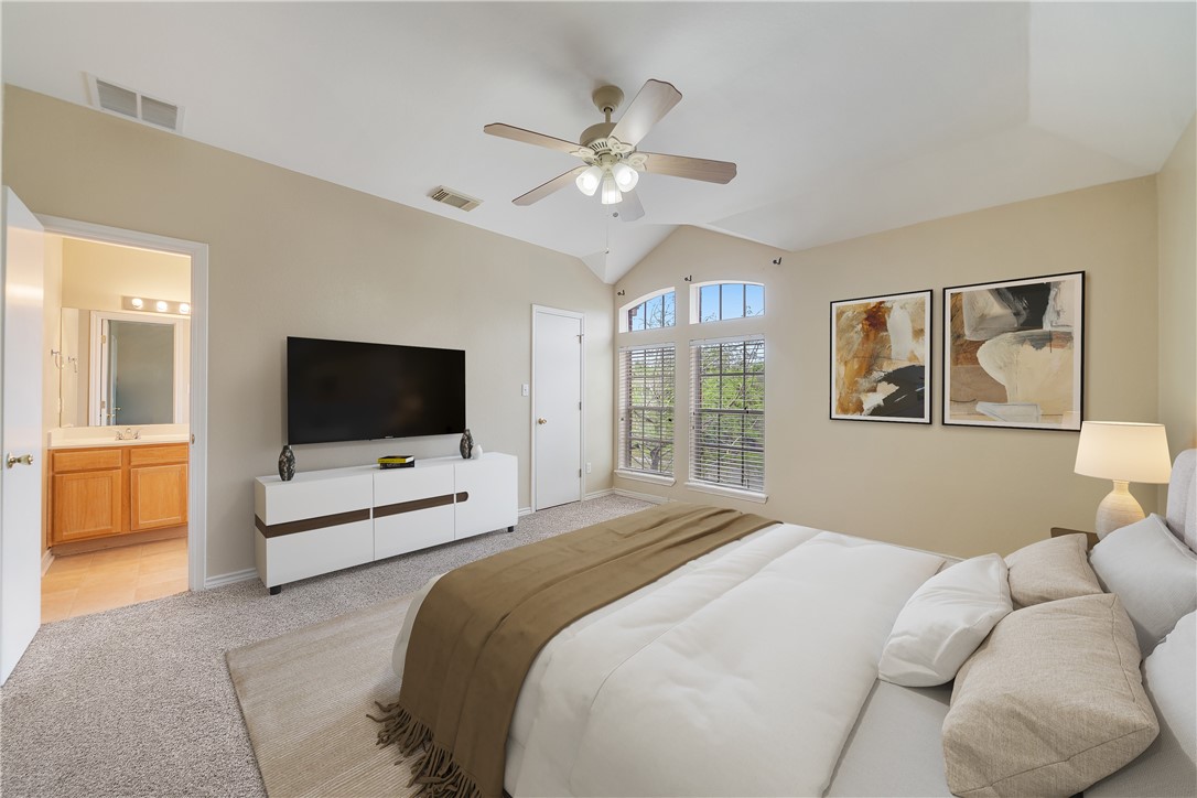 7630 Cedar Brook Drive Corpus Christi, TX 78413 - Photo 16 of 32 a bedroom with a bed and a flat screen tv