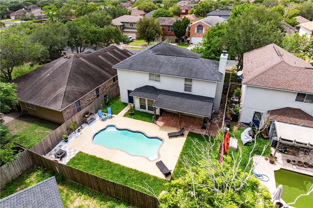 7630 Cedar Brook Drive Corpus Christi, TX 78413 - Photo 32 of 32 an aerial view of a house with garden space and a car park in front of it