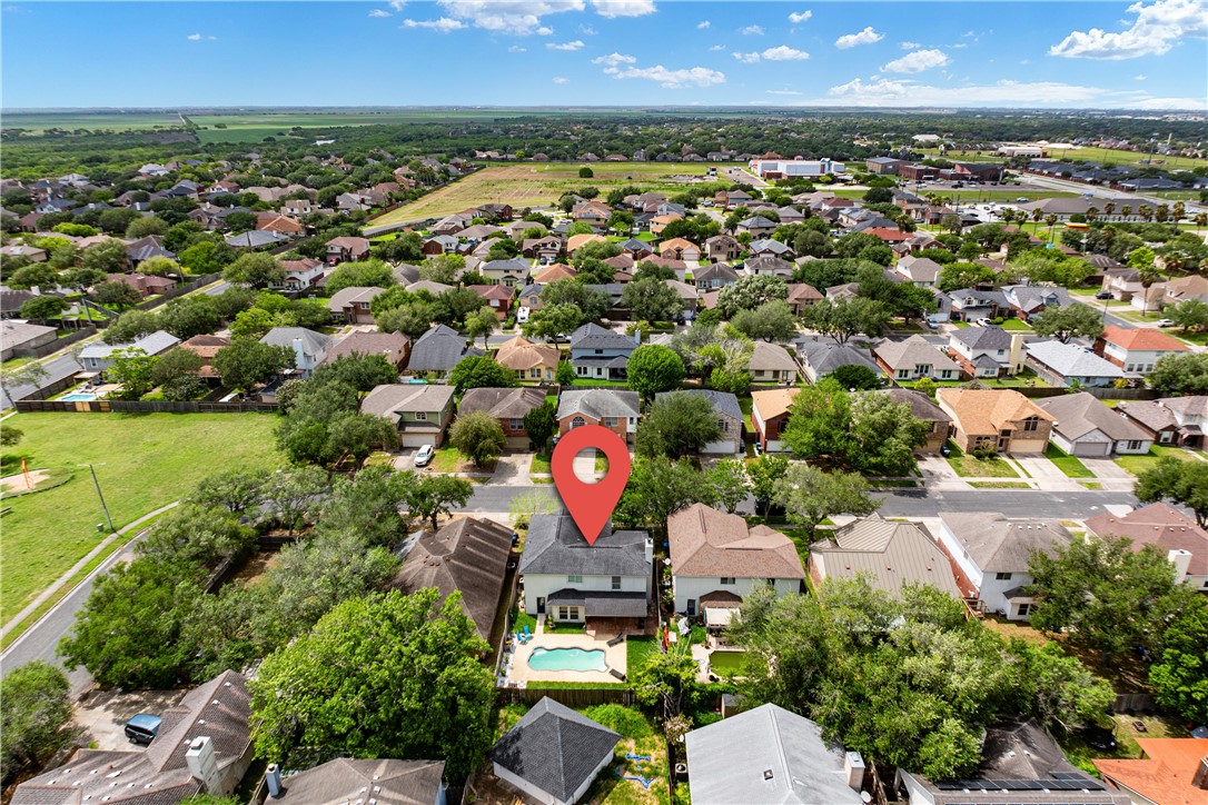 7630 Cedar Brook Drive Corpus Christi, TX 78413 - Photo 4 of 32 an aerial view of residential houses with outdoor space and trees
