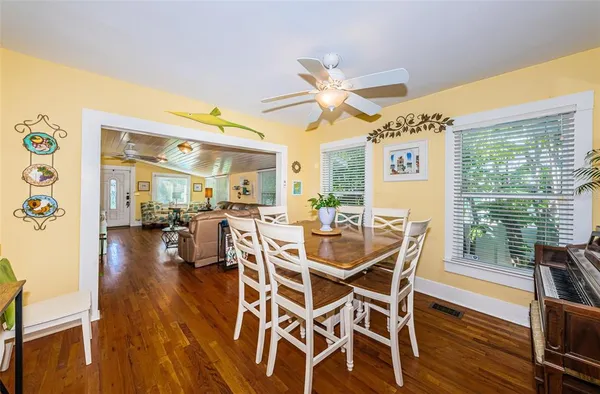 a dining room with furniture window wooden floor
