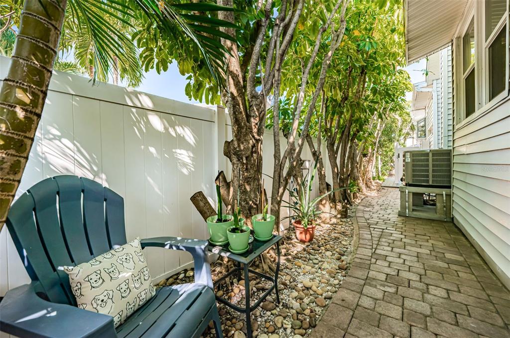 509 70th Avenue St. Pete Beach, FL 33706 - Photo 39 of 50 a view of a porch with furniture