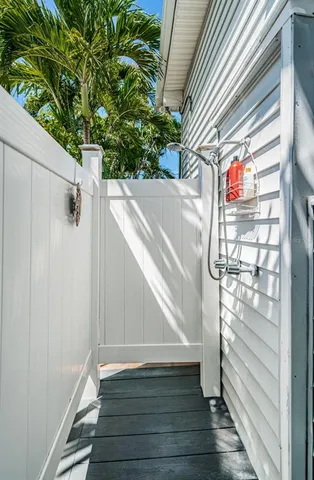 a view of an entryway with wooden floor and door