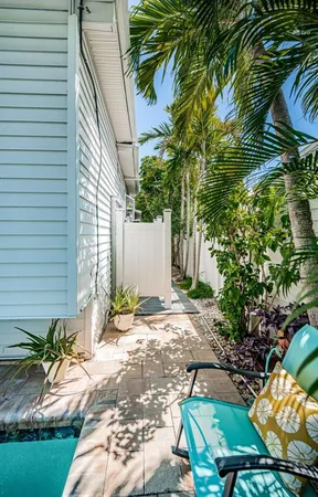a house with a window and yard in back