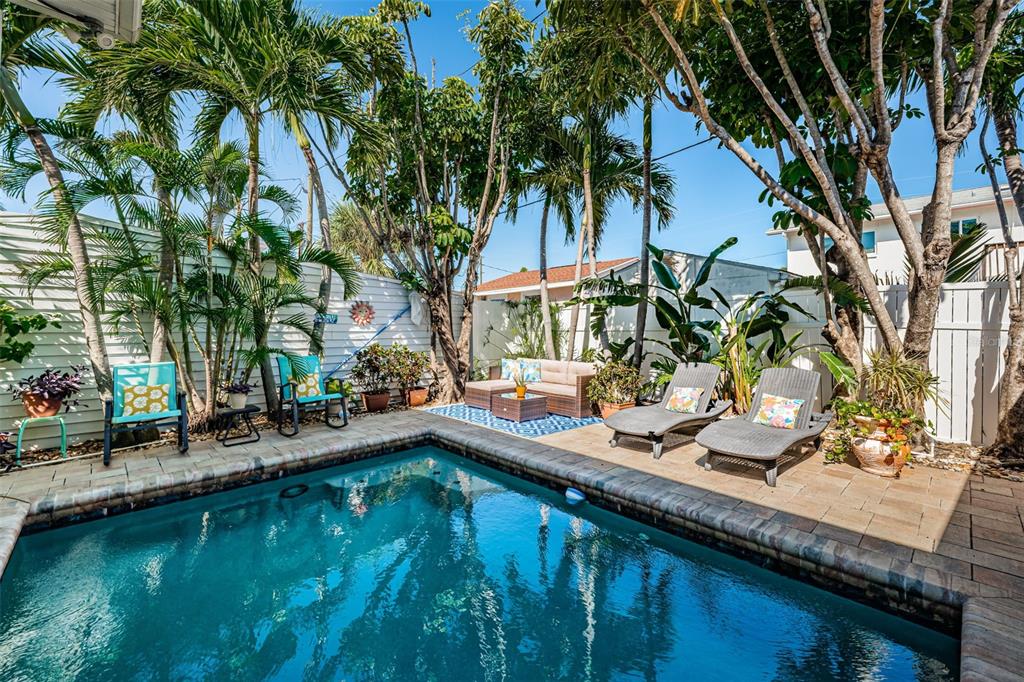 509 70th Avenue St. Pete Beach, FL 33706 - Photo 50 of 50 a view of a house with pool and sitting area