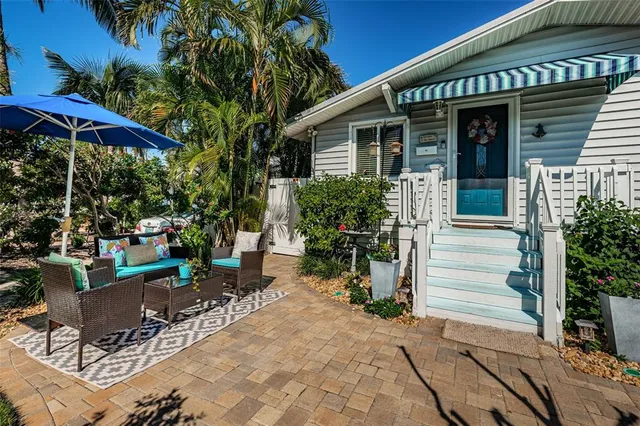 a view of a house with sitting area and furniture