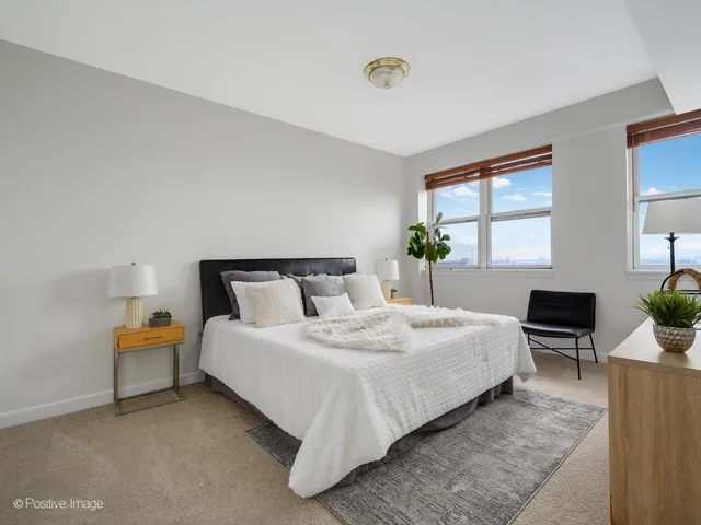 a bedroom with bed and window