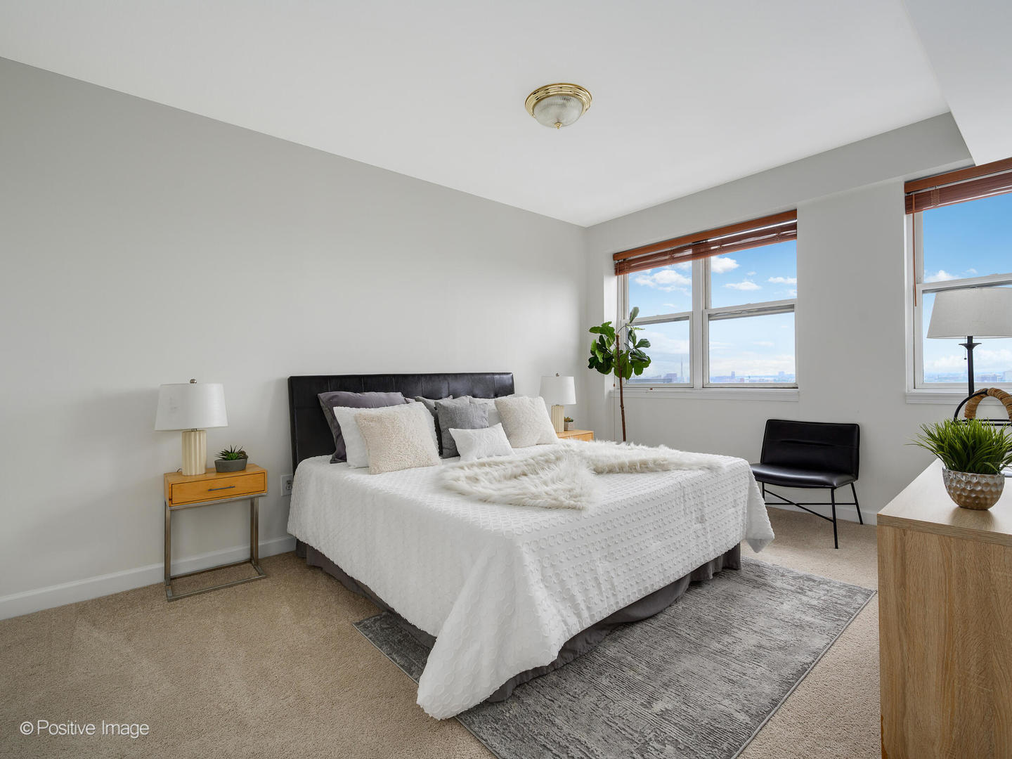 5 East 14th Place, Unit 1506 Chicago, IL 60605 - Photo 12 of 23 a bedroom with bed and window