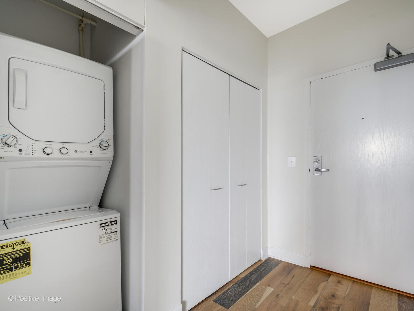 5 East 14th Place, Unit 1506 Chicago, IL 60605 - Photo 17 of 23 a utility room with dryer and washer