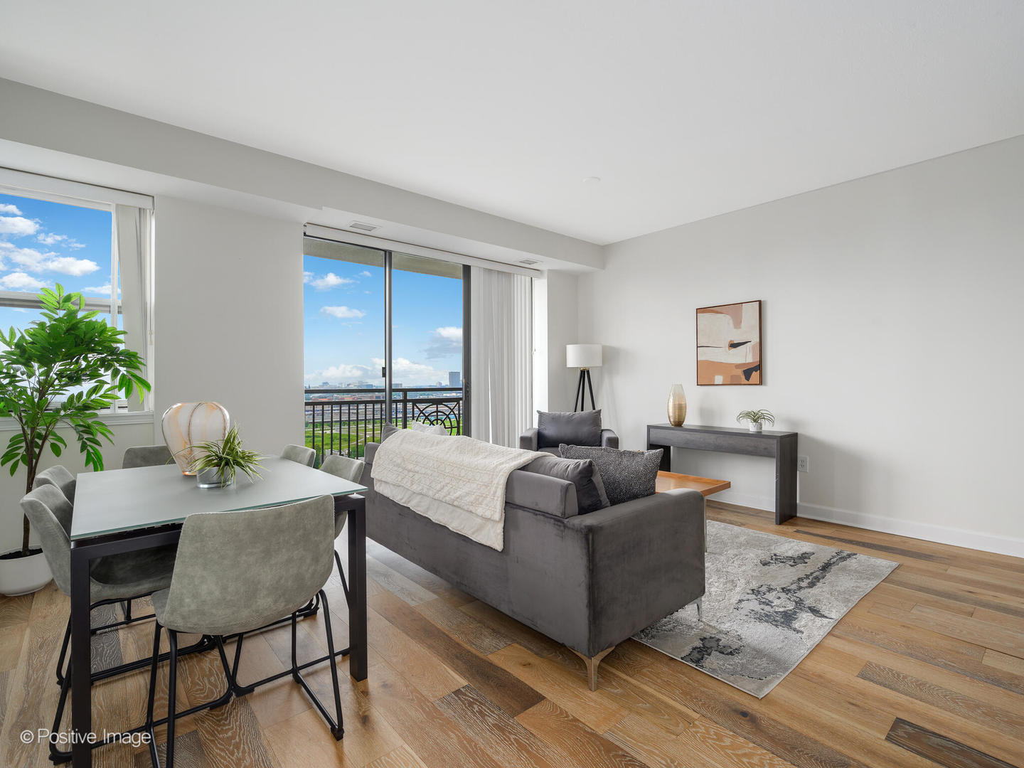 5 East 14th Place, Unit 1506 Chicago, IL 60605 - Photo 7 of 23 a living room with furniture and a large window