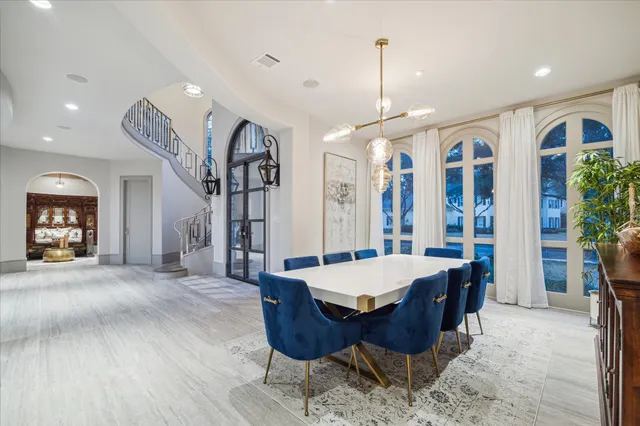 a large kitchen with a table and chairs