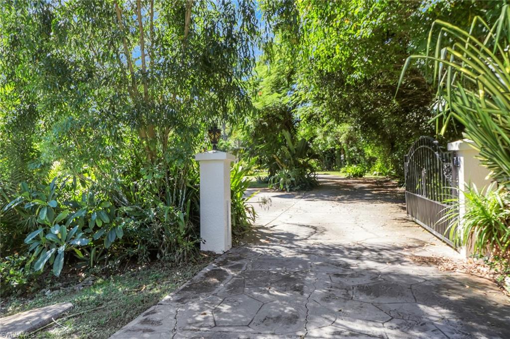 4380 7th Avenue Southwest Naples, FL 34119 - Photo 2 of 39 a view of a tree with a yard