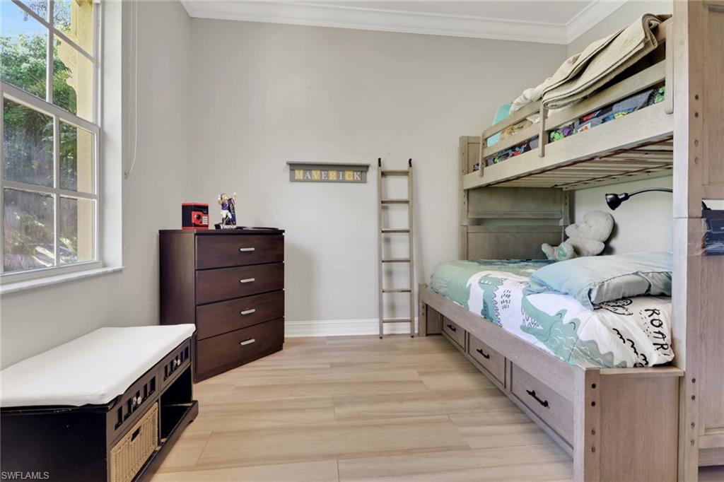 4380 7th Avenue Southwest Naples, FL 34119 - Photo 22 of 39 a bedroom with a bed and a window
