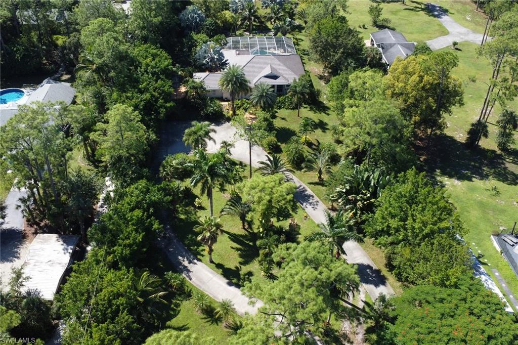 4380 7th Avenue Southwest Naples, FL 34119 - Photo 34 of 39 an aerial view of residential house with outdoor space and trees all around