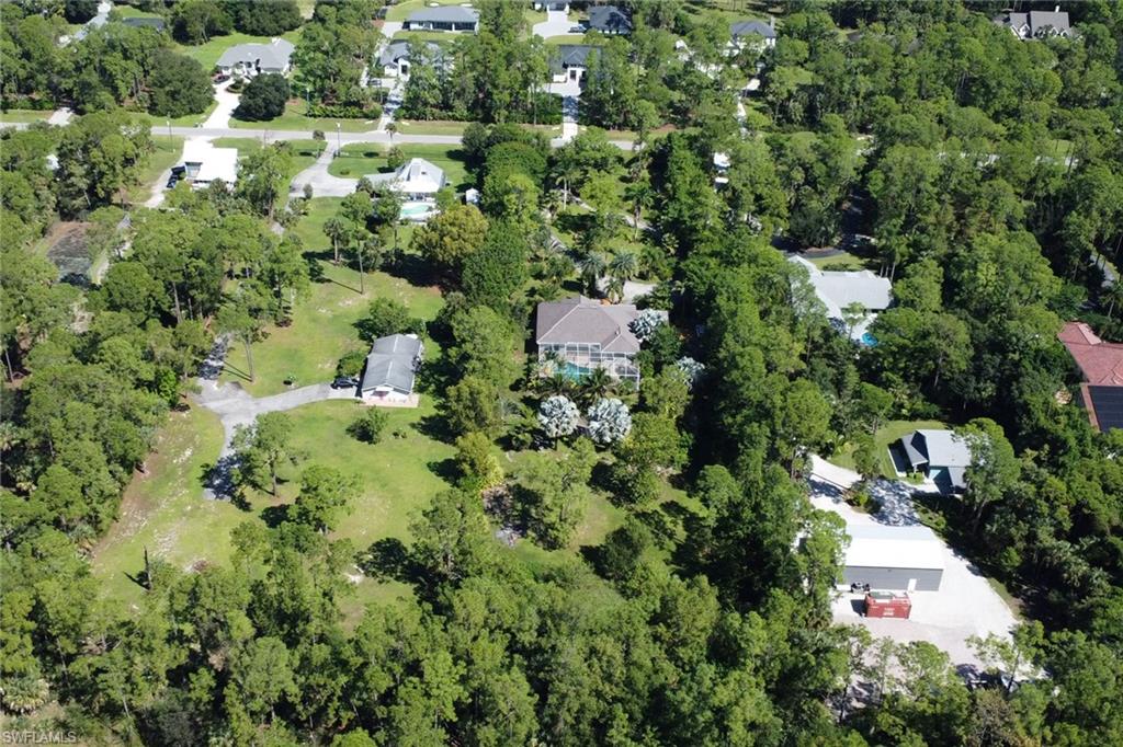 4380 7th Avenue Southwest Naples, FL 34119 - Photo 35 of 39 an aerial view of residential house with outdoor space and trees all around