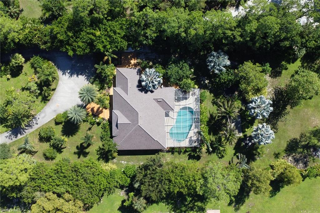 4380 7th Avenue Southwest Naples, FL 34119 - Photo 39 of 39 an aerial view of a house with a yard and outdoor seating