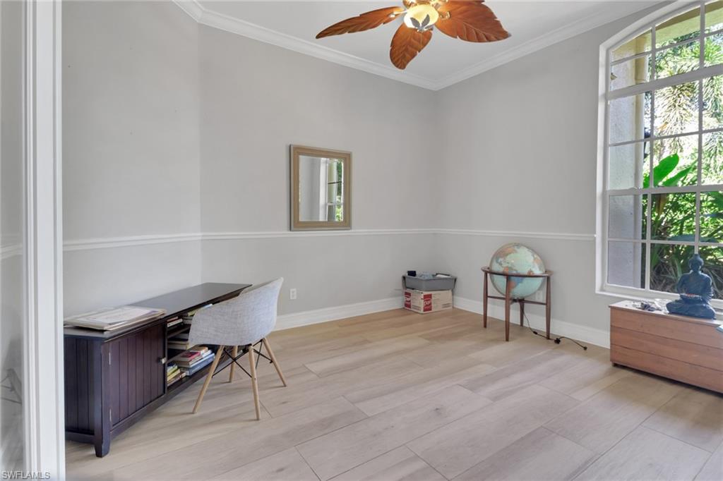 4380 7th Avenue Southwest Naples, FL 34119 - Photo 7 of 39 a workspace with furniture and window