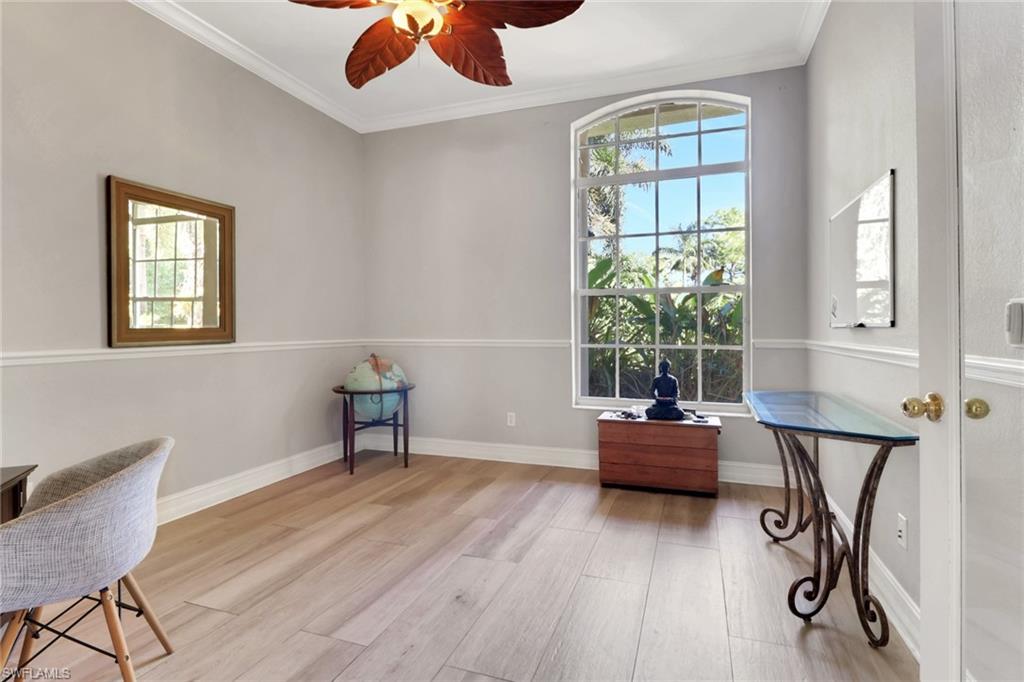 4380 7th Avenue Southwest Naples, FL 34119 - Photo 8 of 39 a living room with furniture and a window