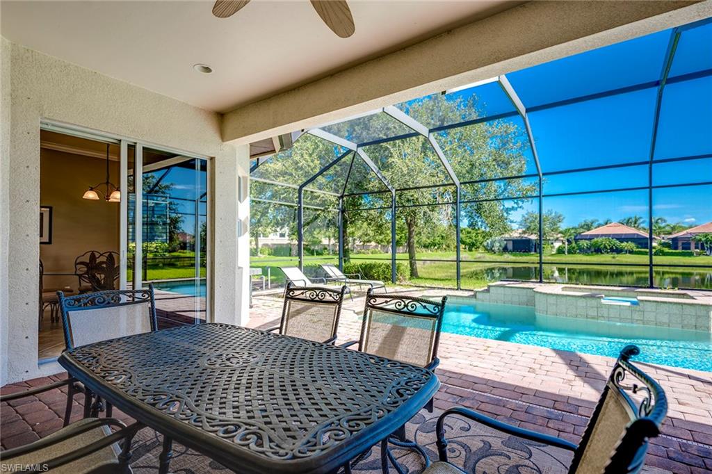 6065 Divot Court Naples, FL 34113 - Photo 13 of 18 a view of a patio with swimming pool