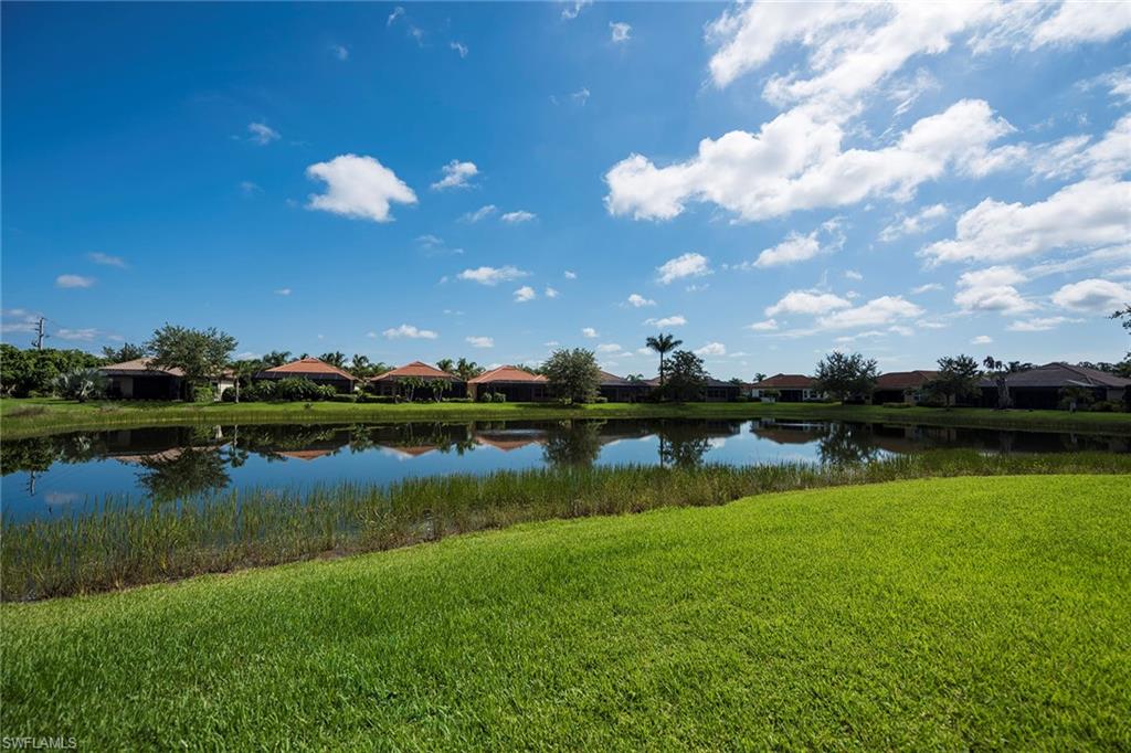 6065 Divot Court Naples, FL 34113 - Photo 17 of 18 a view of a lake in outside field and lake