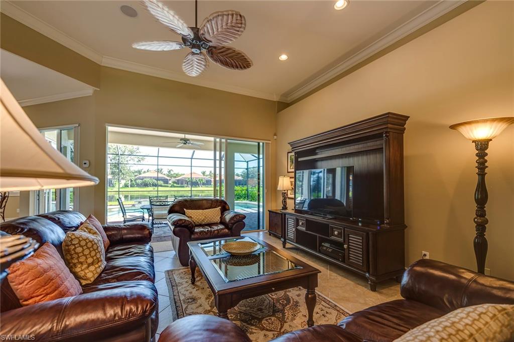 6065 Divot Court Naples, FL 34113 - Photo 3 of 18 a living room with furniture and a flat screen tv