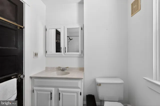 a bathroom with a sink toilet and vanity