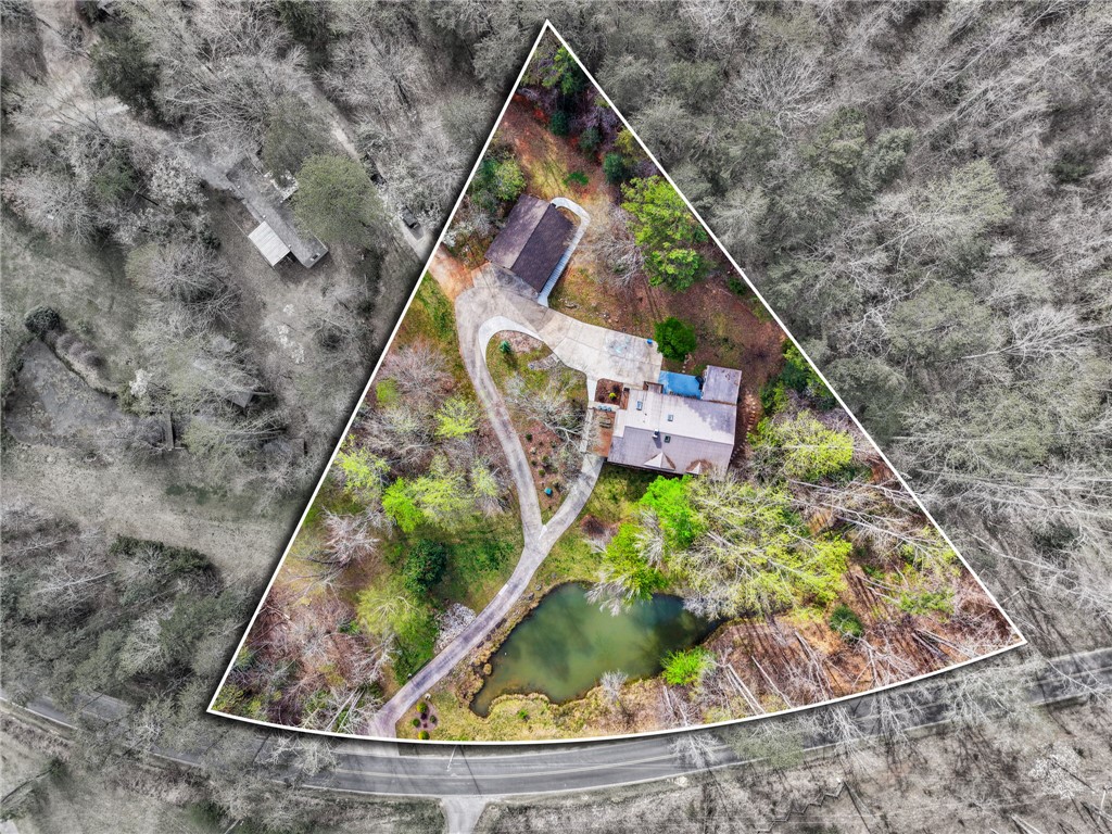 130 Greenbrier Road Salem, SC 29676 - Photo 3 of 48 This bird's-eye view reveals a private retreat nestled among lush trees, complete with a serene pond.