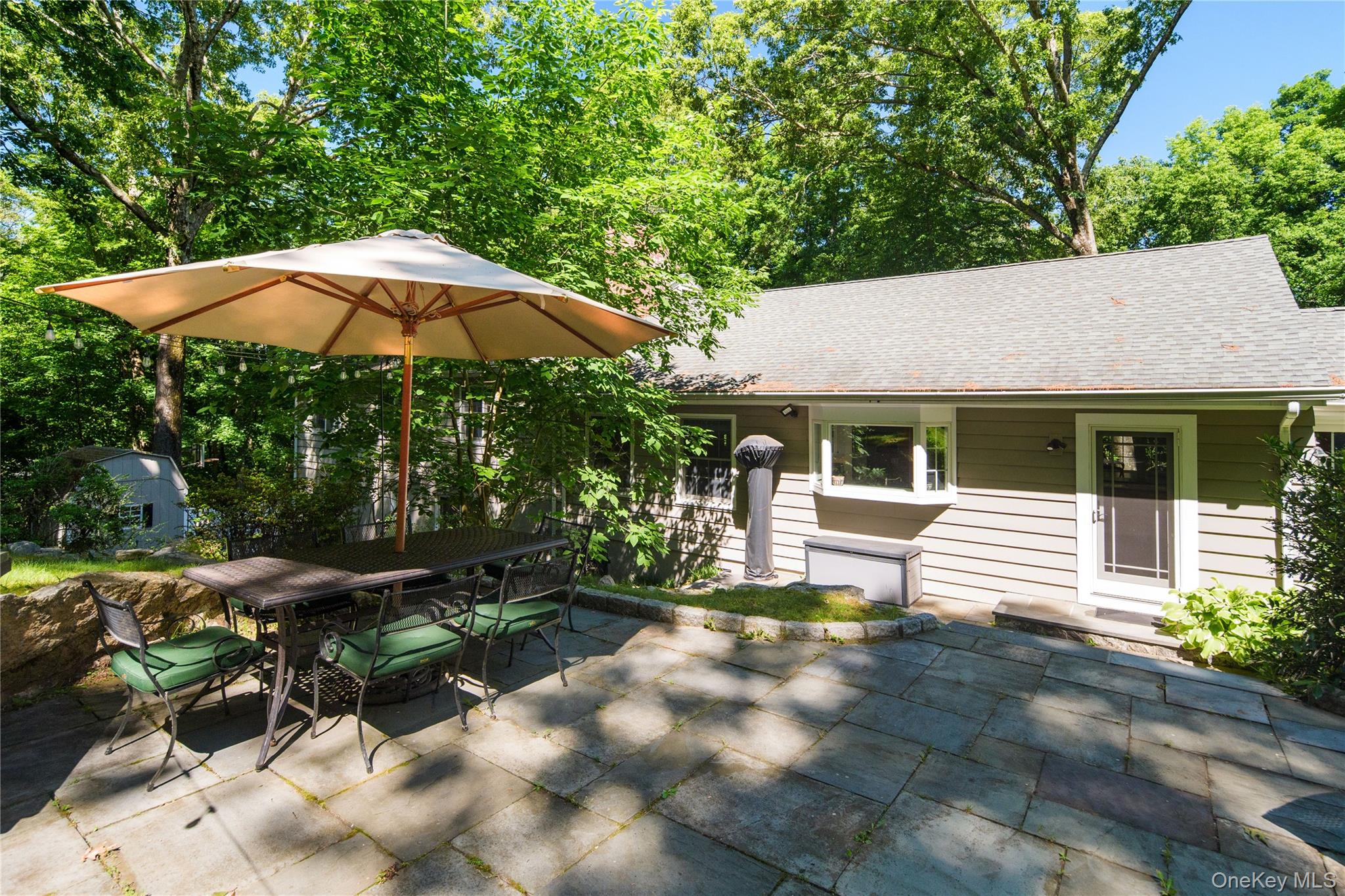 105 Cross Ridge Road Chappaqua, NY 10514 - Photo 8 of 43 A lovely spot to dine alfresco, door from kitchen