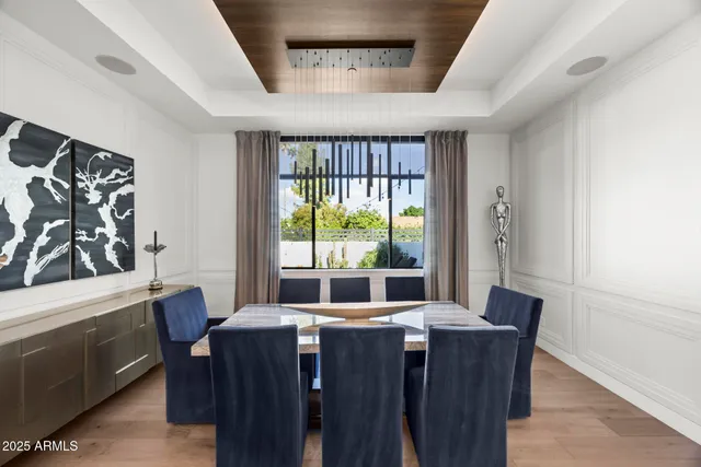 a dining room with furniture and window