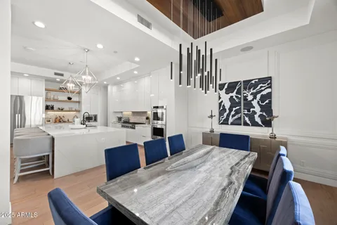 a living room with stainless steel appliances kitchen island granite countertop furniture and a kitchen view