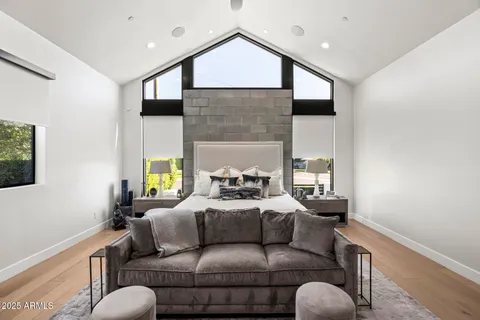 a living room with furniture fireplace and a flat screen tv