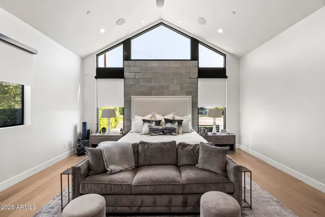 a living room with furniture fireplace and a flat screen tv