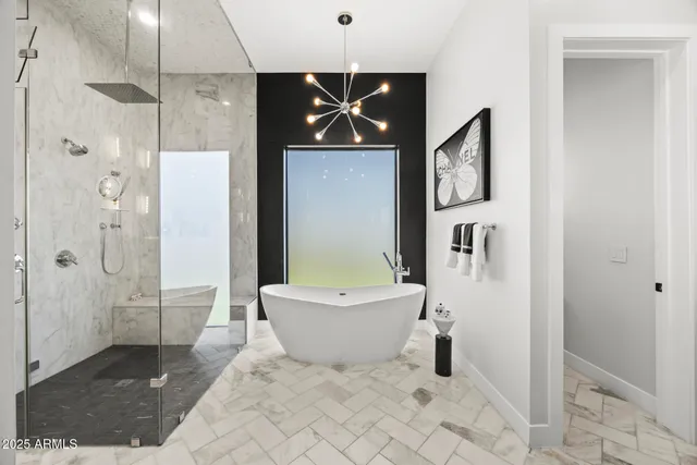 a bathroom with a bathtub and shower
