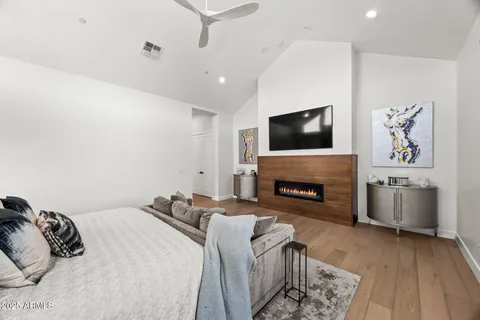 a bedroom with a bed and a fireplace