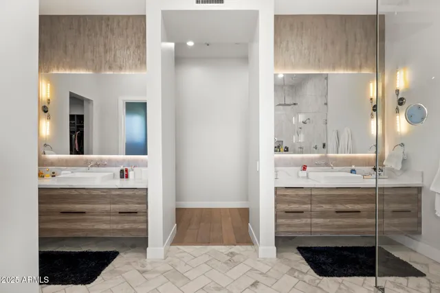 a bathroom with a sink a vanity and a mirror