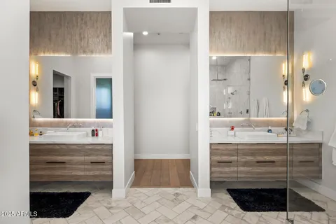 a bathroom with a sink a vanity and a mirror