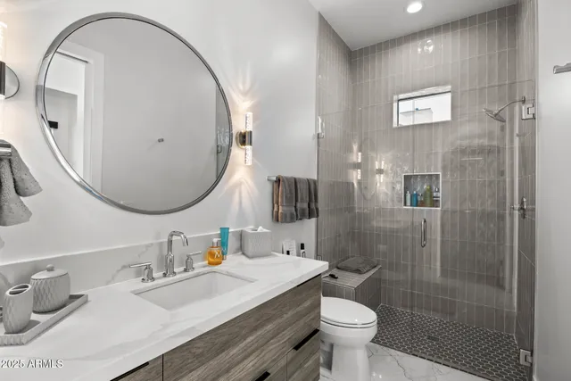 a bedroom with a large bed and a large window