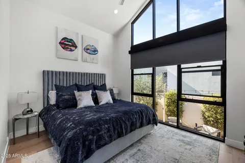 a work room with furniture and a flat screen tv