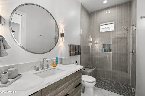 a bedroom with a large bed and a large window