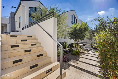 a view of backyard with sitting area