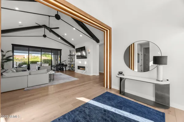 a view of a living room and entry way