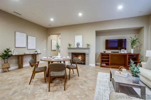 a living room with furniture and kitchen view