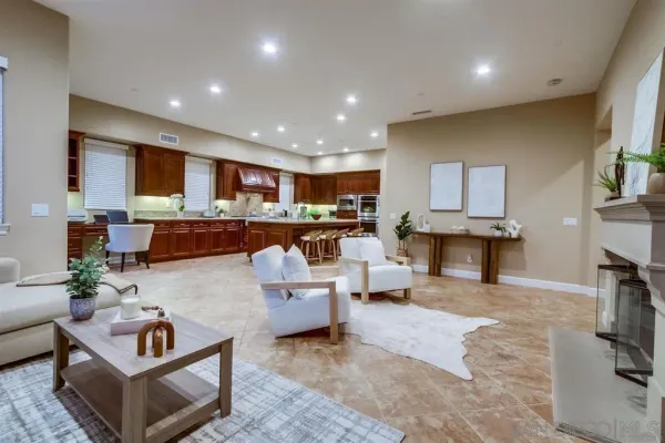 a living room with furniture large window and a flat screen television