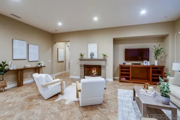 a spacious bedroom with a bed and a fireplace