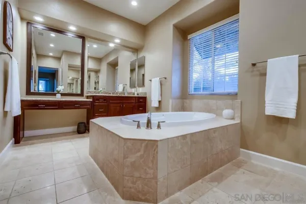 a view of a hallway with bathroom