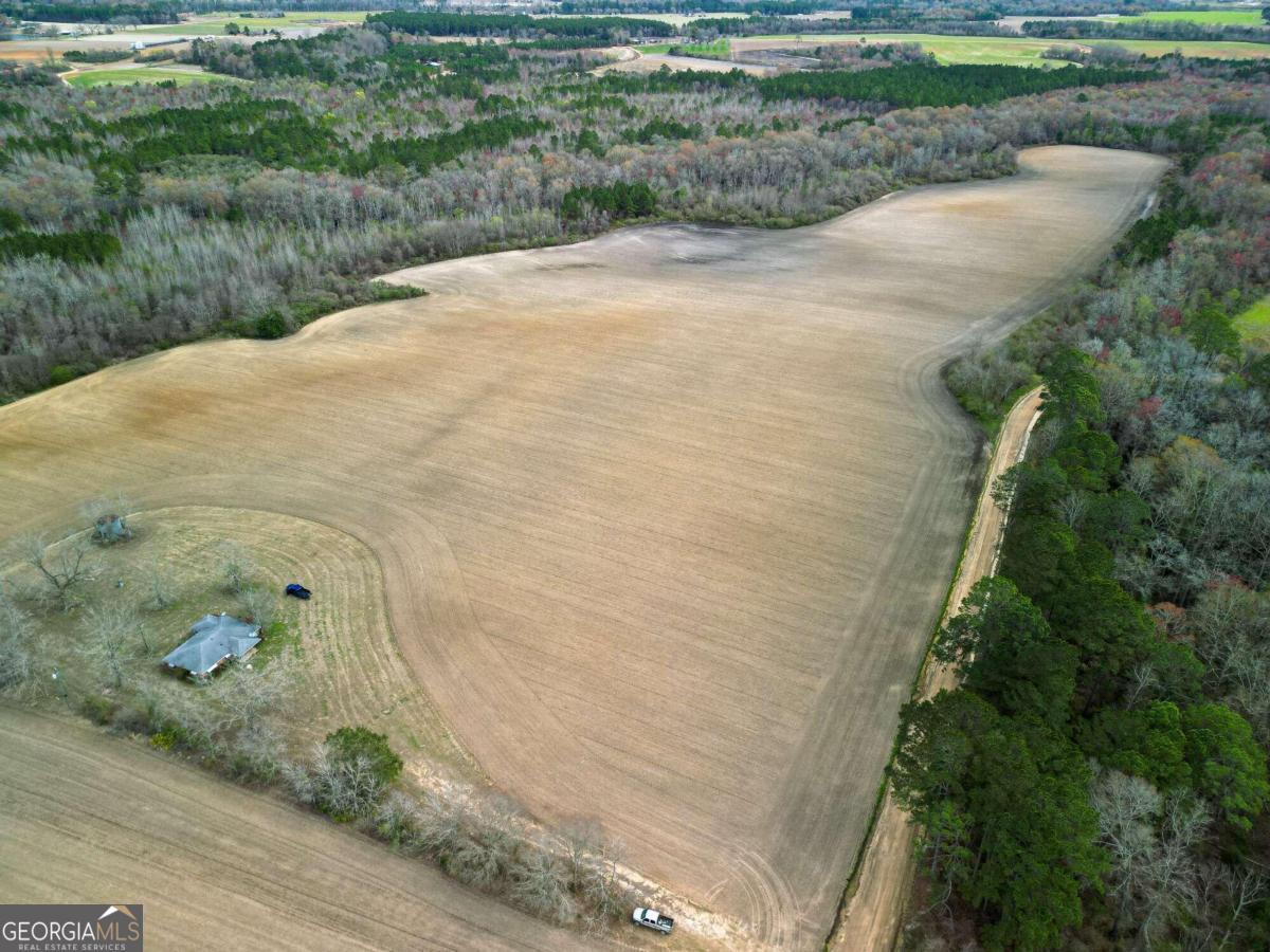 549 Leggett Road Baxley, GA 31513 - Photo 1 of 1 a view of a dry yard with wooden fence
