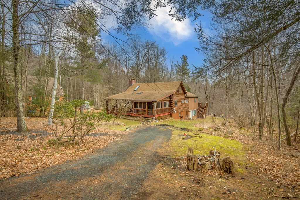302 Fox Den Road Tolland, MA 01034 - Photo 3 of 41 a view of a house with a yard