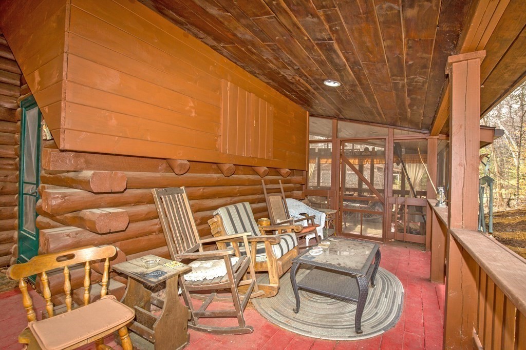 302 Fox Den Road Tolland, MA 01034 - Photo 4 of 41 a view of a chairs and table in patio