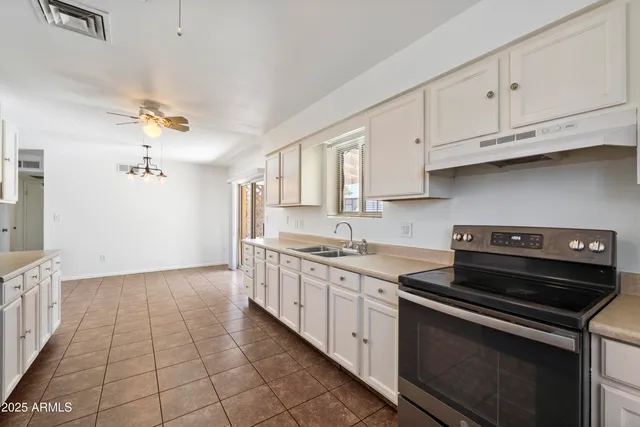 a kitchen with a stove and a sink
