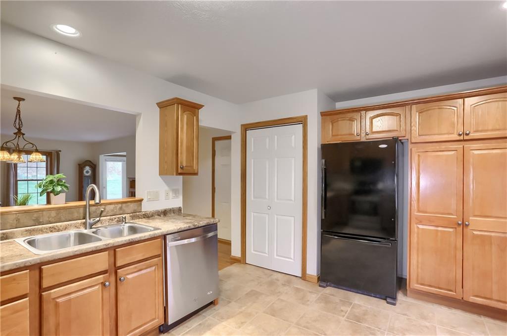 119 South Butler Street Saxonburg, PA 16056 - Photo 11 of 39 a large kitchen with a refrigerator and countertop
